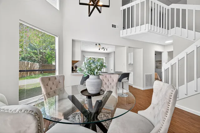 a view of a dining room with furniture window and wooden floor