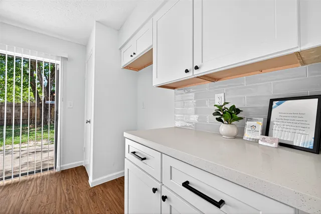 a bathroom with a double vanity sink mirror and shower