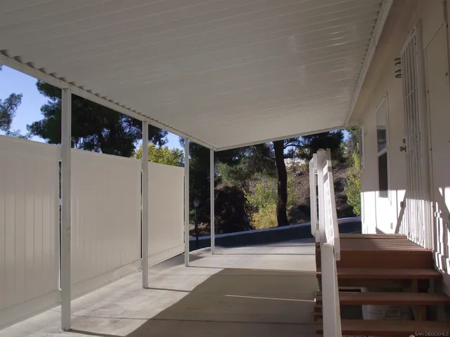 a backyard of a house with wooden floor