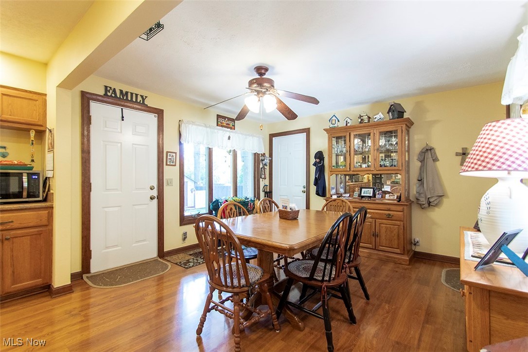 20749 Albion Road Strongsville, OH 44149 - Photo 8 of 35 Dining space featuring baseboards, wood finished floors, and a ceiling fan