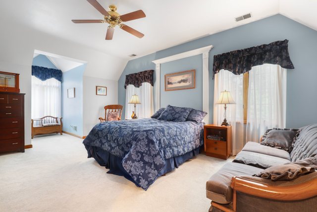 420 Timber Ridge Drive Bartlett, IL 60103 - Photo 13 of 23 a bedroom with a bed couch and window