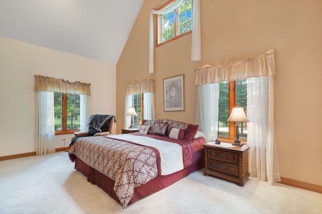 420 Timber Ridge Drive Bartlett, IL 60103 - Photo 5 of 23 a bedroom with a bed lamp and a large window