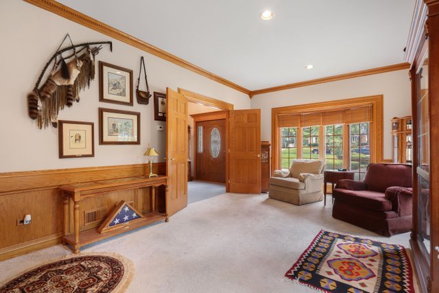 420 Timber Ridge Drive Bartlett, IL 60103 - Photo 7 of 23 a living room with furniture and large windows