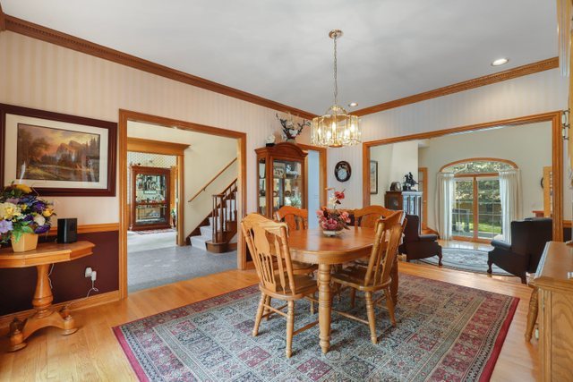 420 Timber Ridge Drive Bartlett, IL 60103 - Photo 8 of 23 a view of a dining room with furniture window and wooden floor