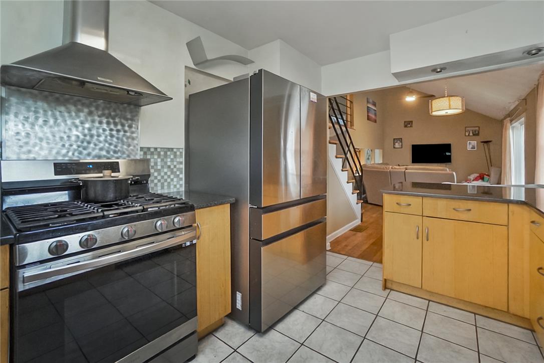 3031 Shakespeare Road Bethlehem, PA 18017 - Photo 10 of 30 Culinary delights await in this compact kitchen with sleek stainless steel appliances and ample counter space. Picture has been digitally enhanced.