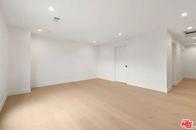 a bathroom with a toilet sink and shower