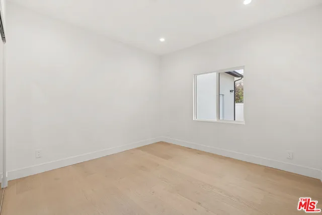 a bathroom with a shower a sink a toilet and shower