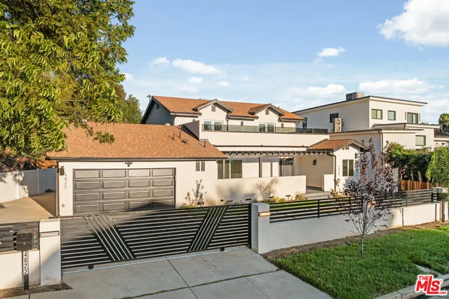 a front view of a house with garage