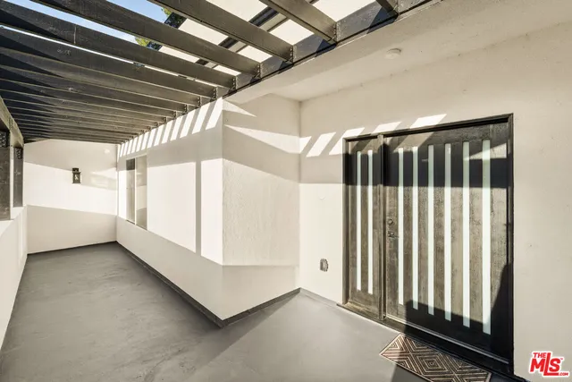 a view of a hallway with stairs