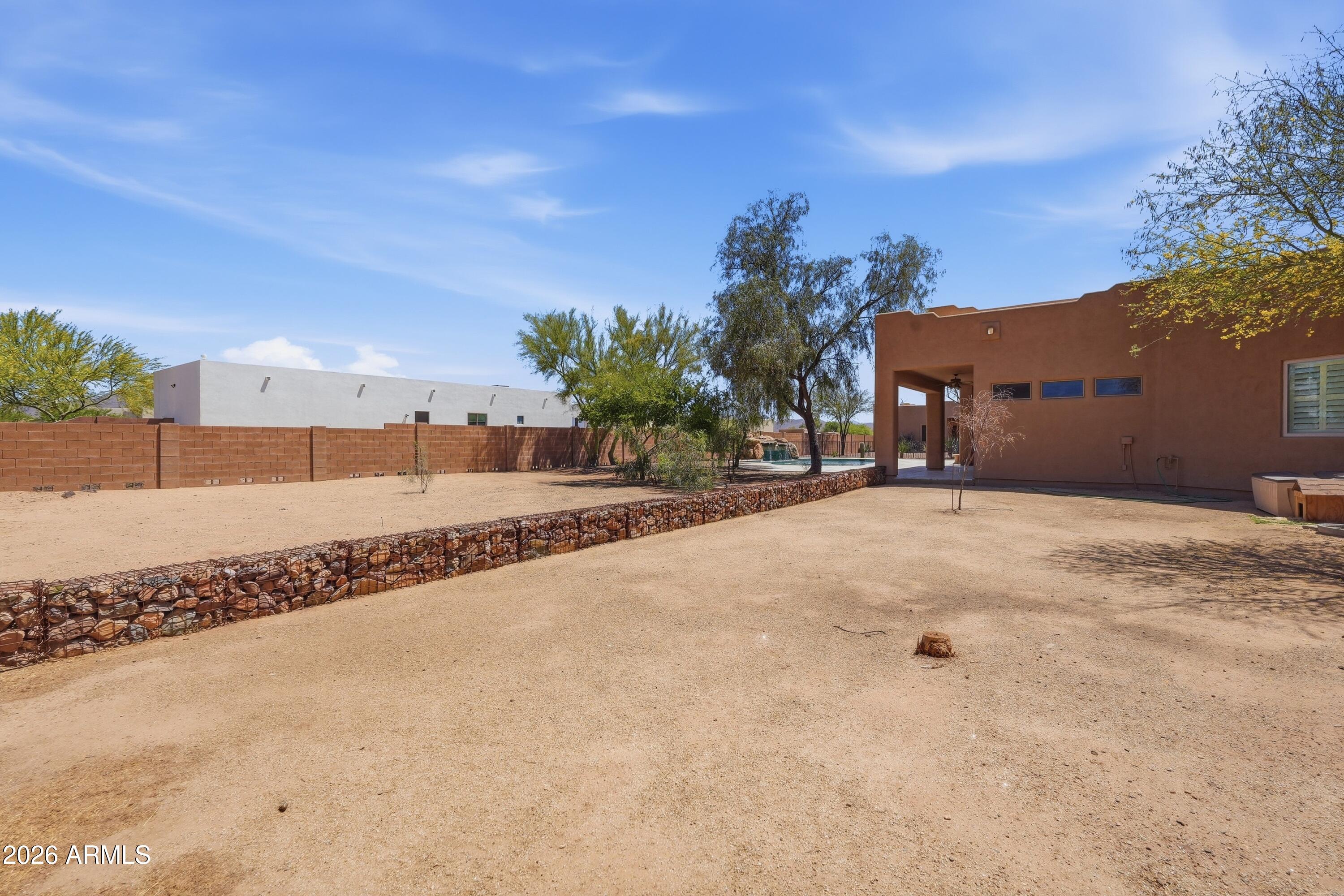 2616 West Canyon Road Phoenix, AZ 85086 - Photo 43 of 45 a view of a road with a building in the background