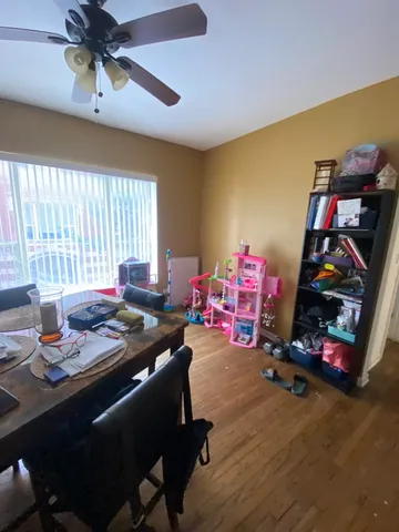 a room with furniture a chandelier and a window