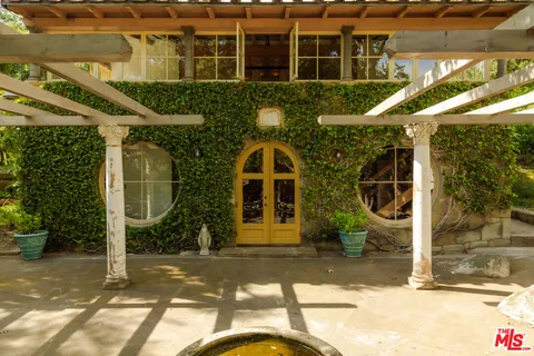 a kitchen with sink cabinets and white appliances
