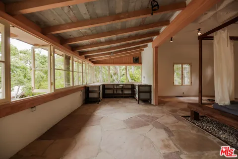 a view of hallway with wooden floor