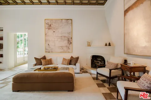 a kitchen with a sink a counter top space and a window