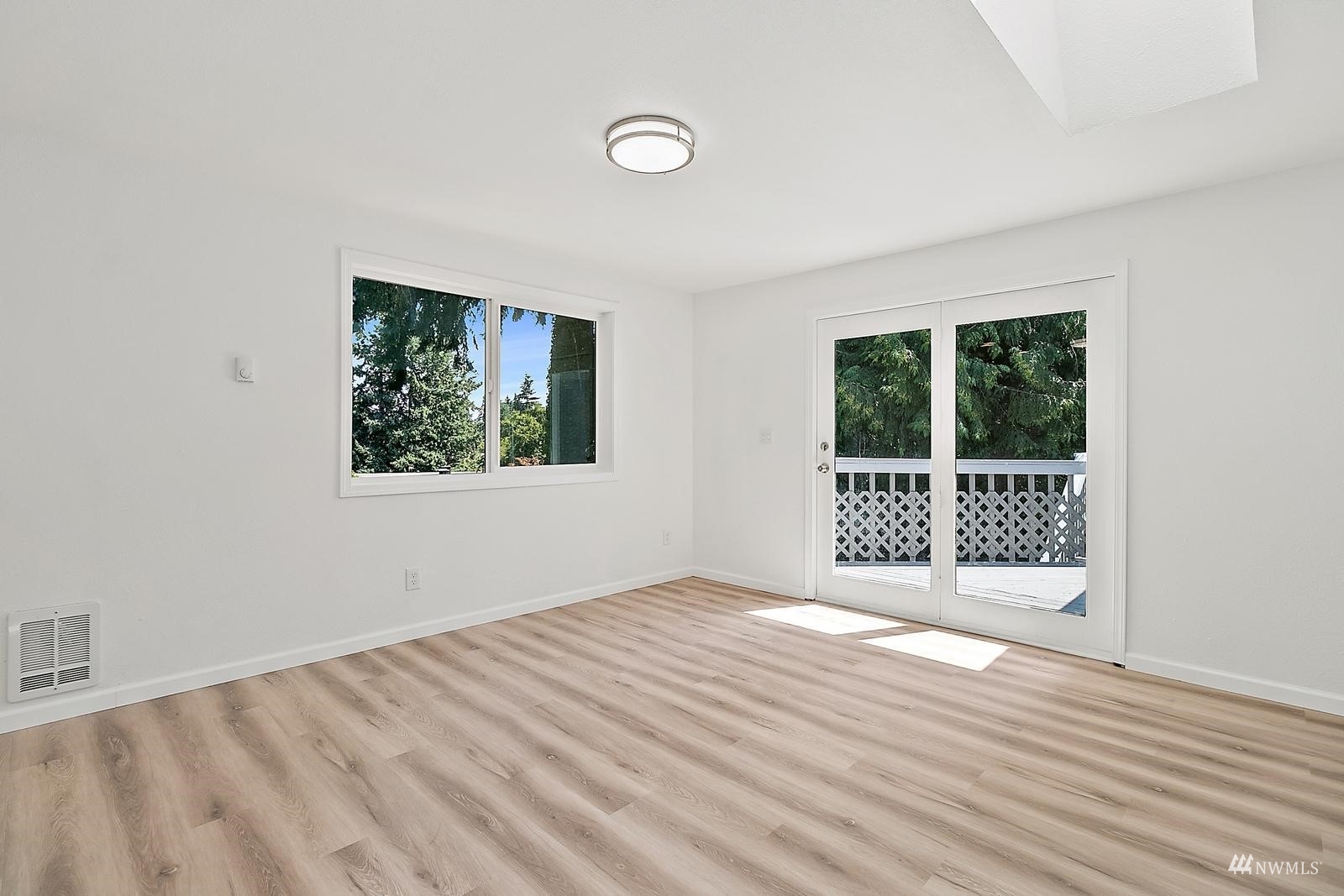 33330 29th Place Southwest Federal Way, WA 98023 - Photo 11 of 37 a view of an empty room with wooden floor and a window