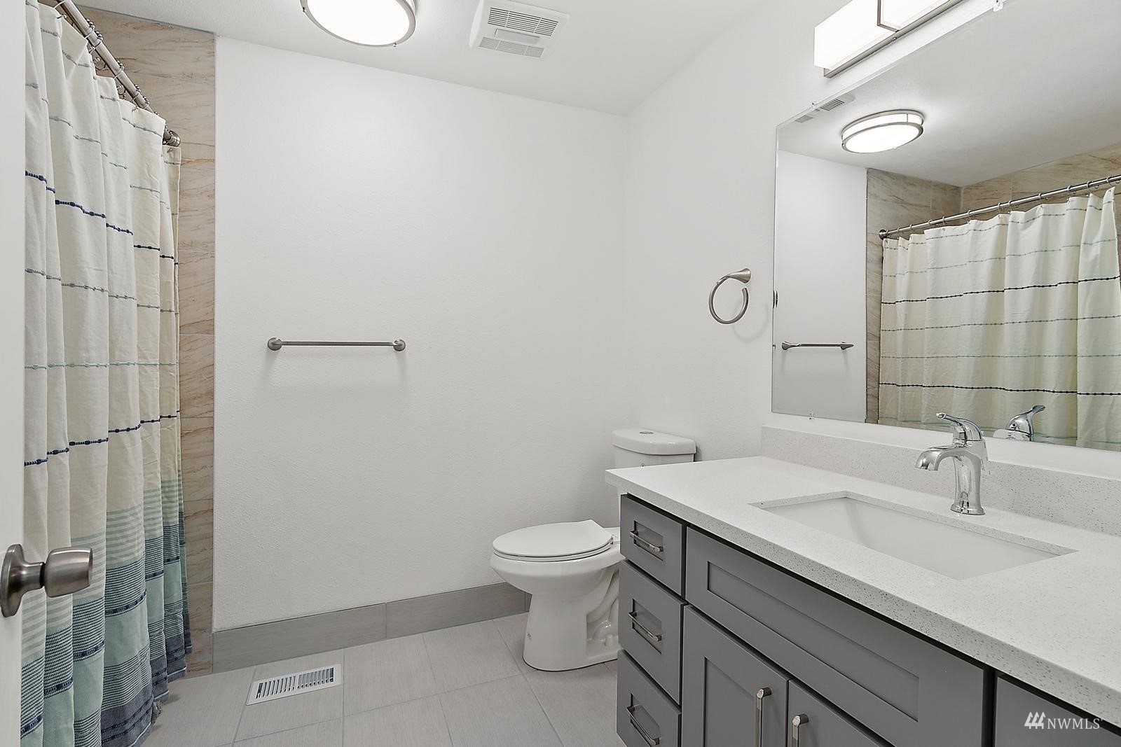 33330 29th Place Southwest Federal Way, WA 98023 - Photo 18 of 37 a bathroom with a sink a toilet and shower