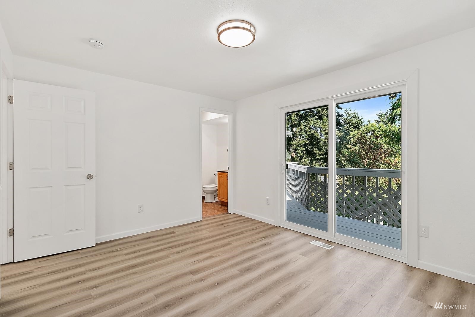 33330 29th Place Southwest Federal Way, WA 98023 - Photo 22 of 37 a view of an empty room with wooden floor and a window