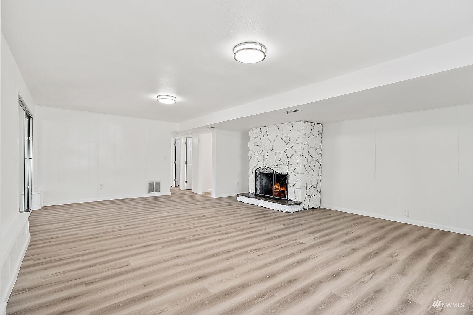 33330 29th Place Southwest Federal Way, WA 98023 - Photo 28 of 37 a view of empty room with fireplace and wooden floor