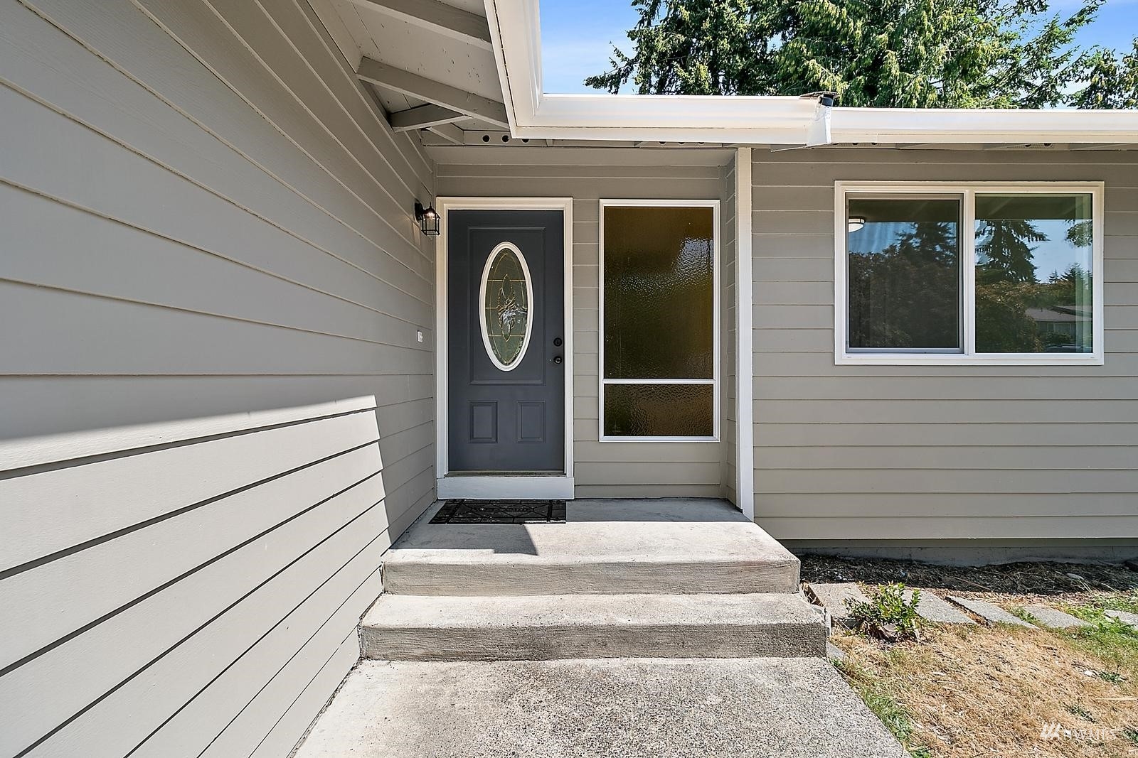 33330 29th Place Southwest Federal Way, WA 98023 - Photo 3 of 37 a front view of a house with entryway