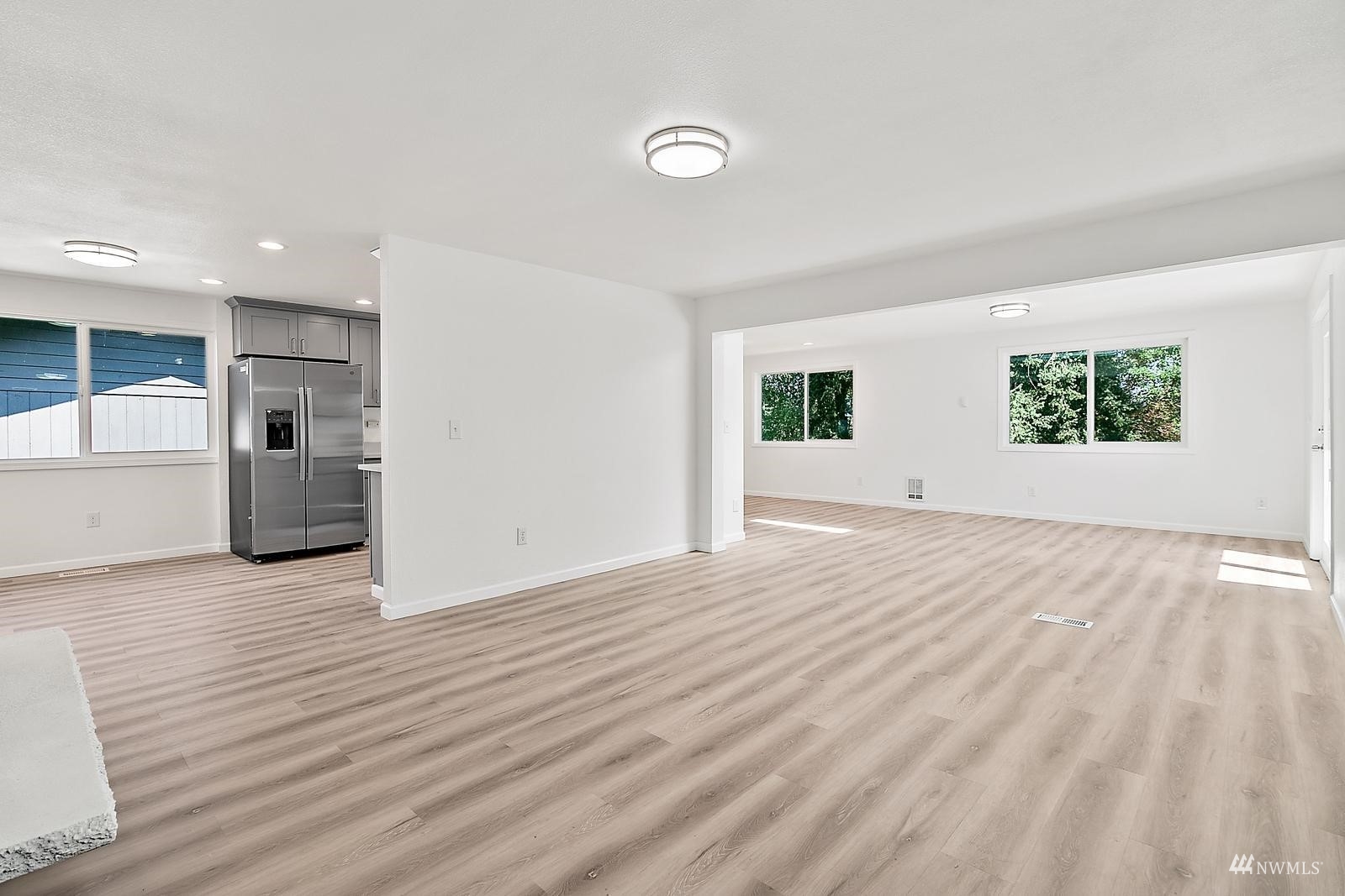 33330 29th Place Southwest Federal Way, WA 98023 - Photo 8 of 37 an empty room with wooden floor and windows