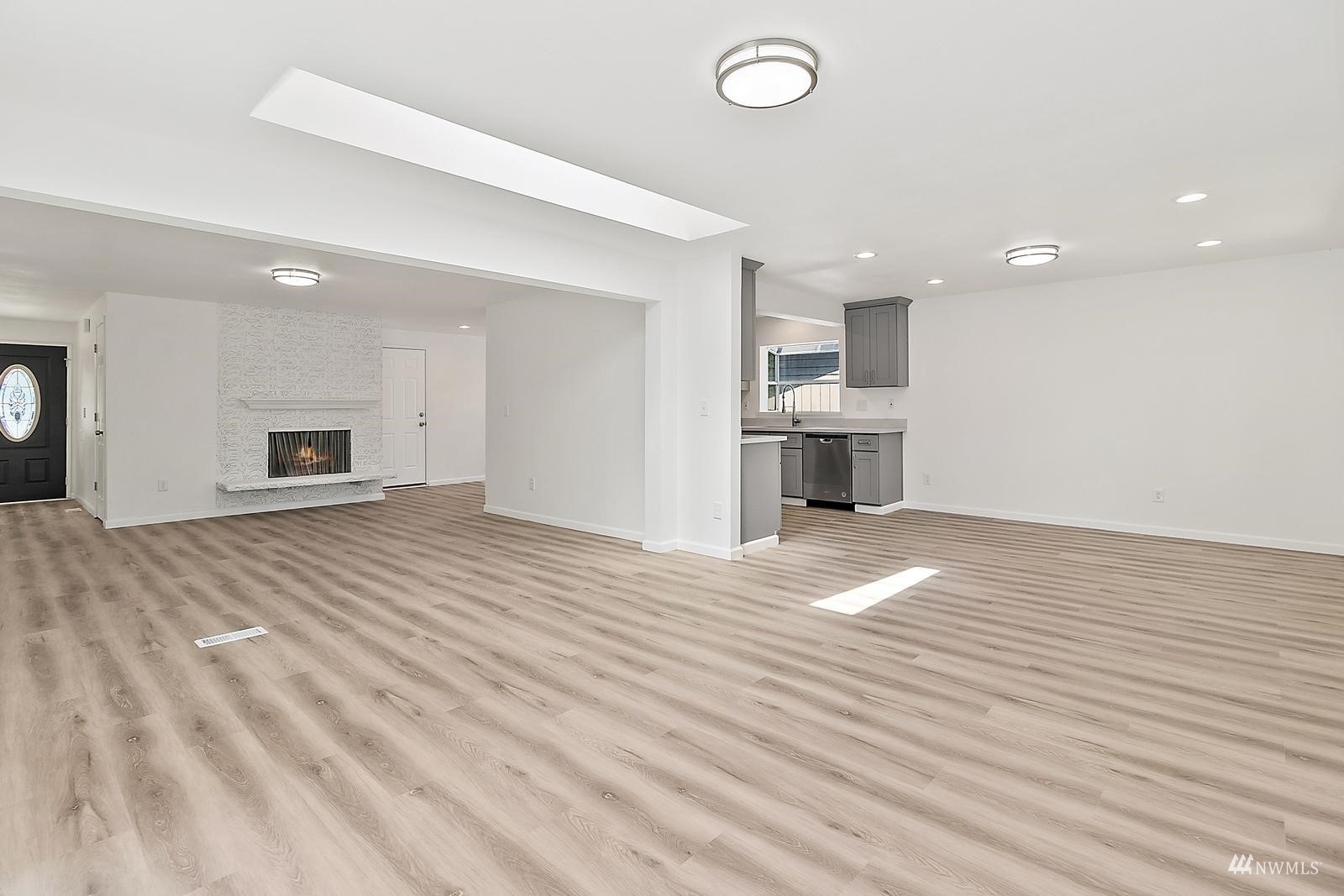 33330 29th Place Southwest Federal Way, WA 98023 - Photo 9 of 37 an empty room with wooden floor and windows