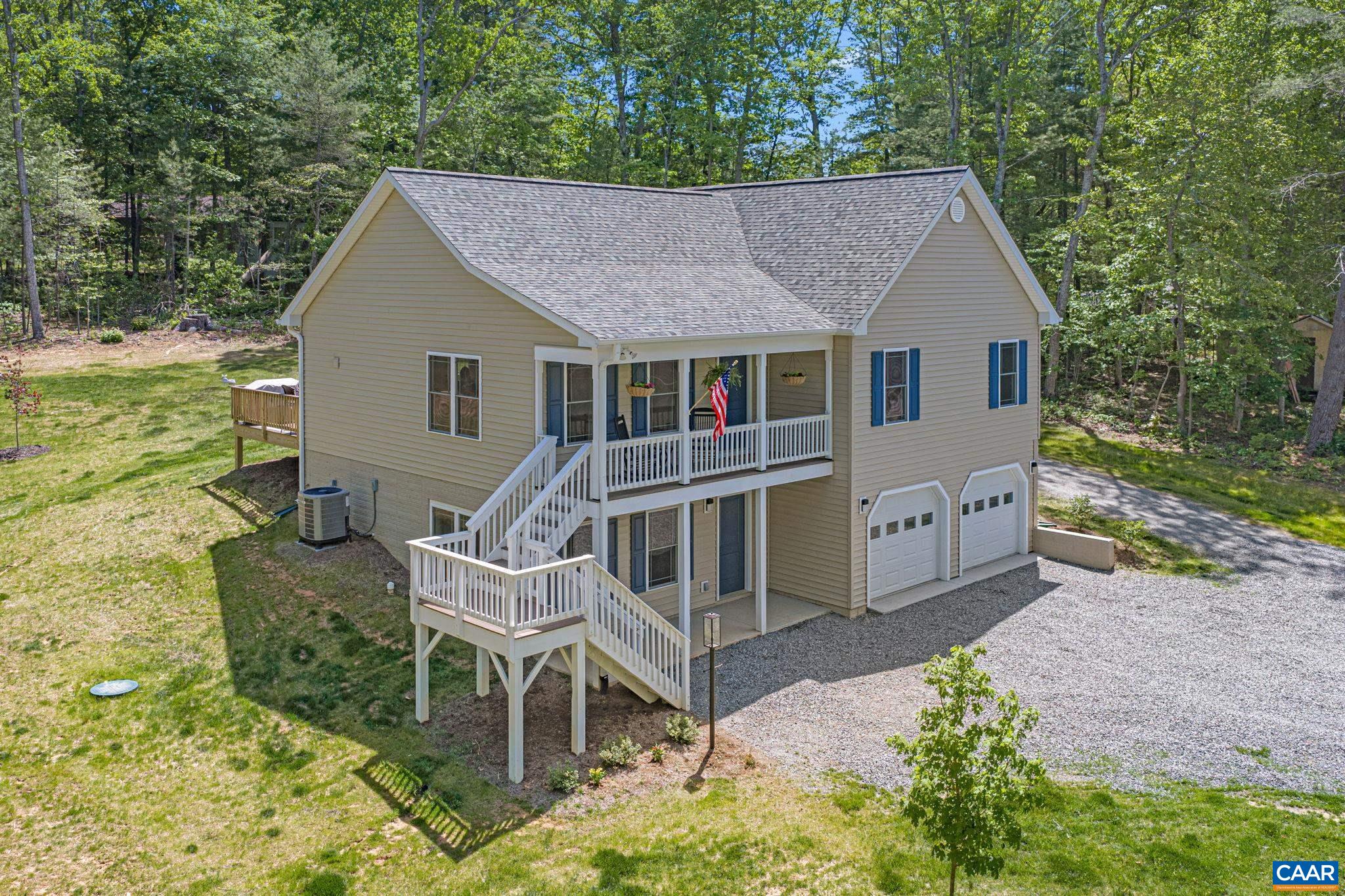 230 Fox Hollow Road Ruckersville, VA 22968 - Photo 41 of 42 a view of a house with backyard and chairs