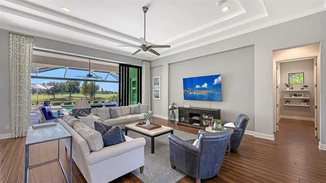 a kitchen with kitchen island granite countertop a sink cabinets and wooden floor