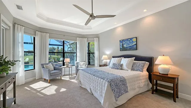a bathroom with a granite countertop double vanity sink toilet mirror and shower
