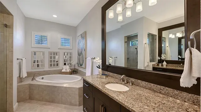 a living room with furniture a floor to ceiling window and a flat screen tv