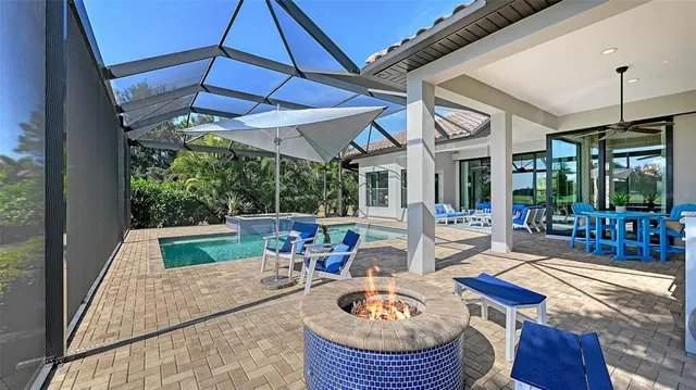 a view of a swimming pool and lounge chairs