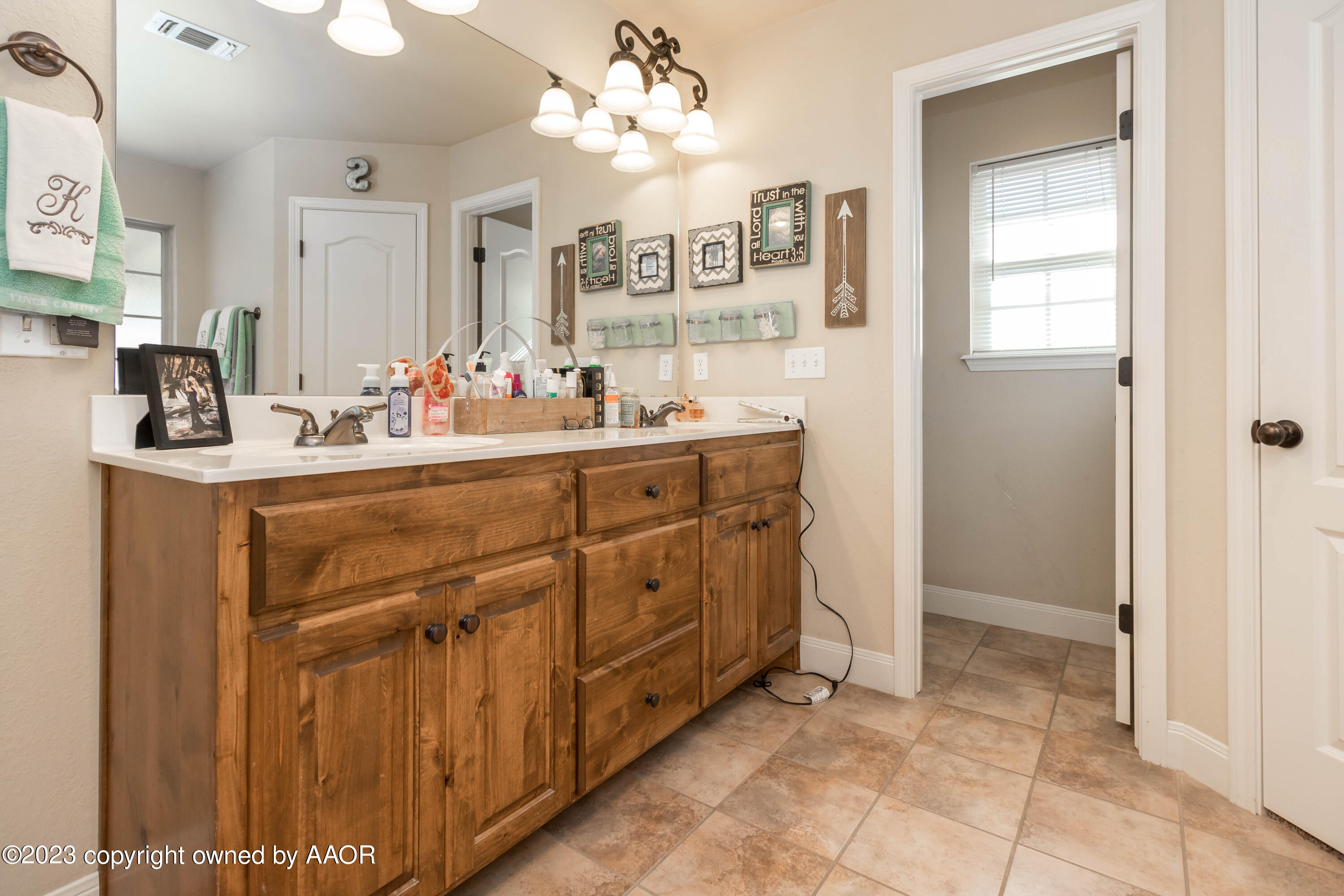 5802 South Rusk Street Amarillo, TX 79118 - Photo 13 of 17 a room with mirror and cabinets