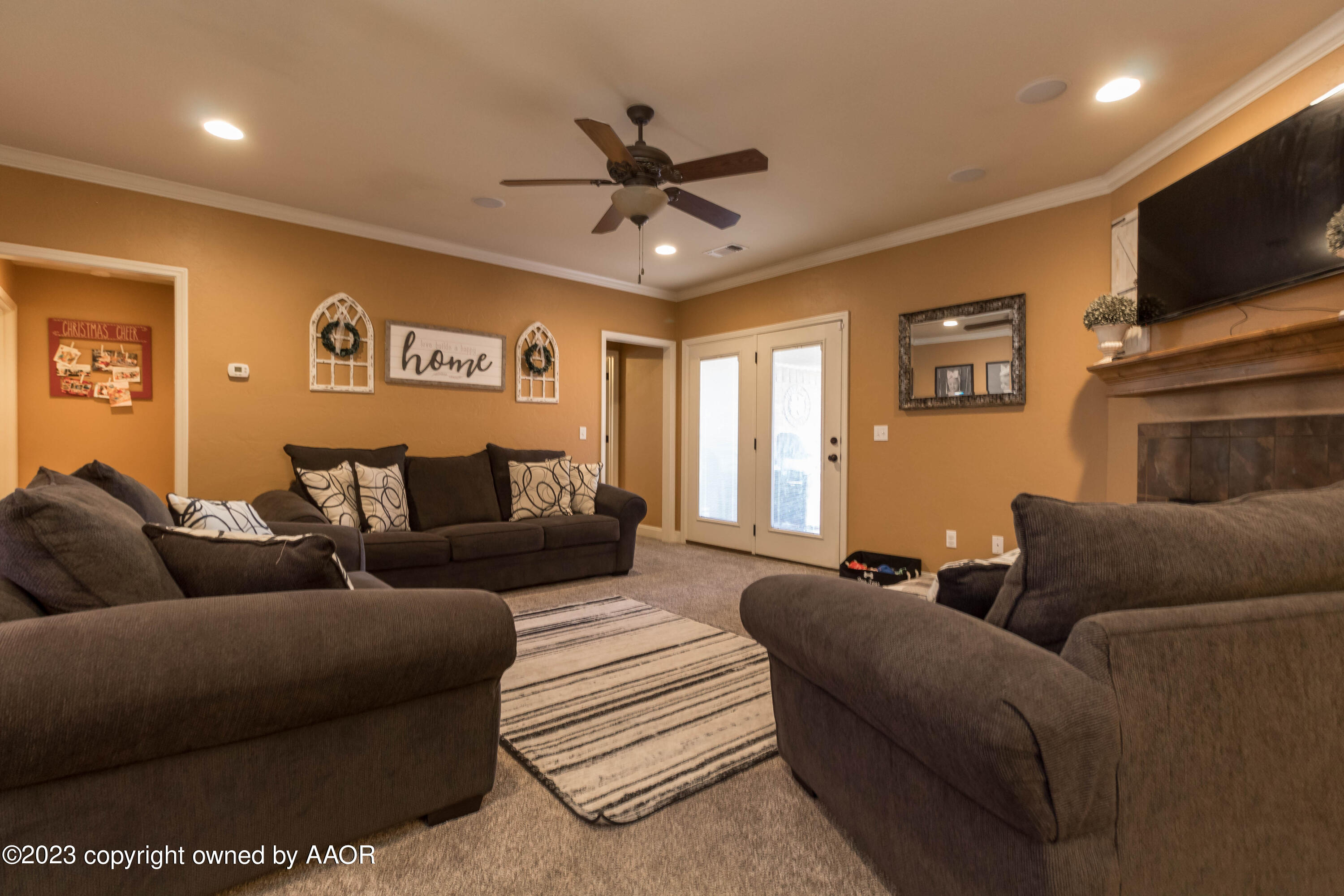 5802 South Rusk Street Amarillo, TX 79118 - Photo 4 of 17 a living room with furniture and a flat screen tv