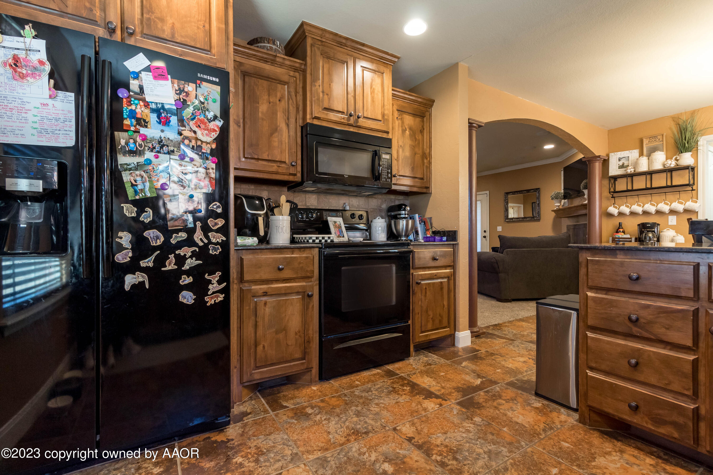 5802 South Rusk Street Amarillo, TX 79118 - Photo 5 of 17 a kitchen with stainless steel appliances granite countertop a refrigerator and a stove top oven