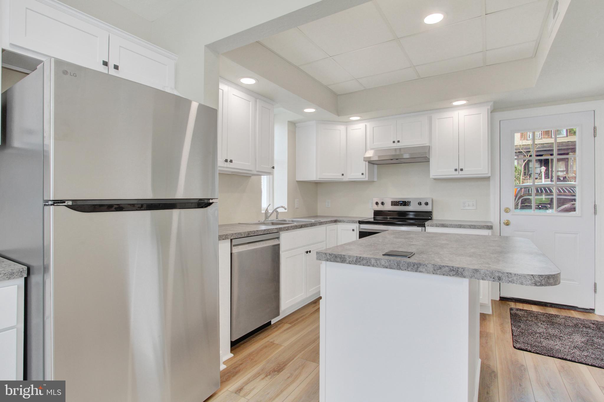 103 Rampike Hill Road Bendersville, PA 17304 - Photo 11 of 22 a kitchen with stainless steel appliances granite countertop refrigerator sink and cabinets