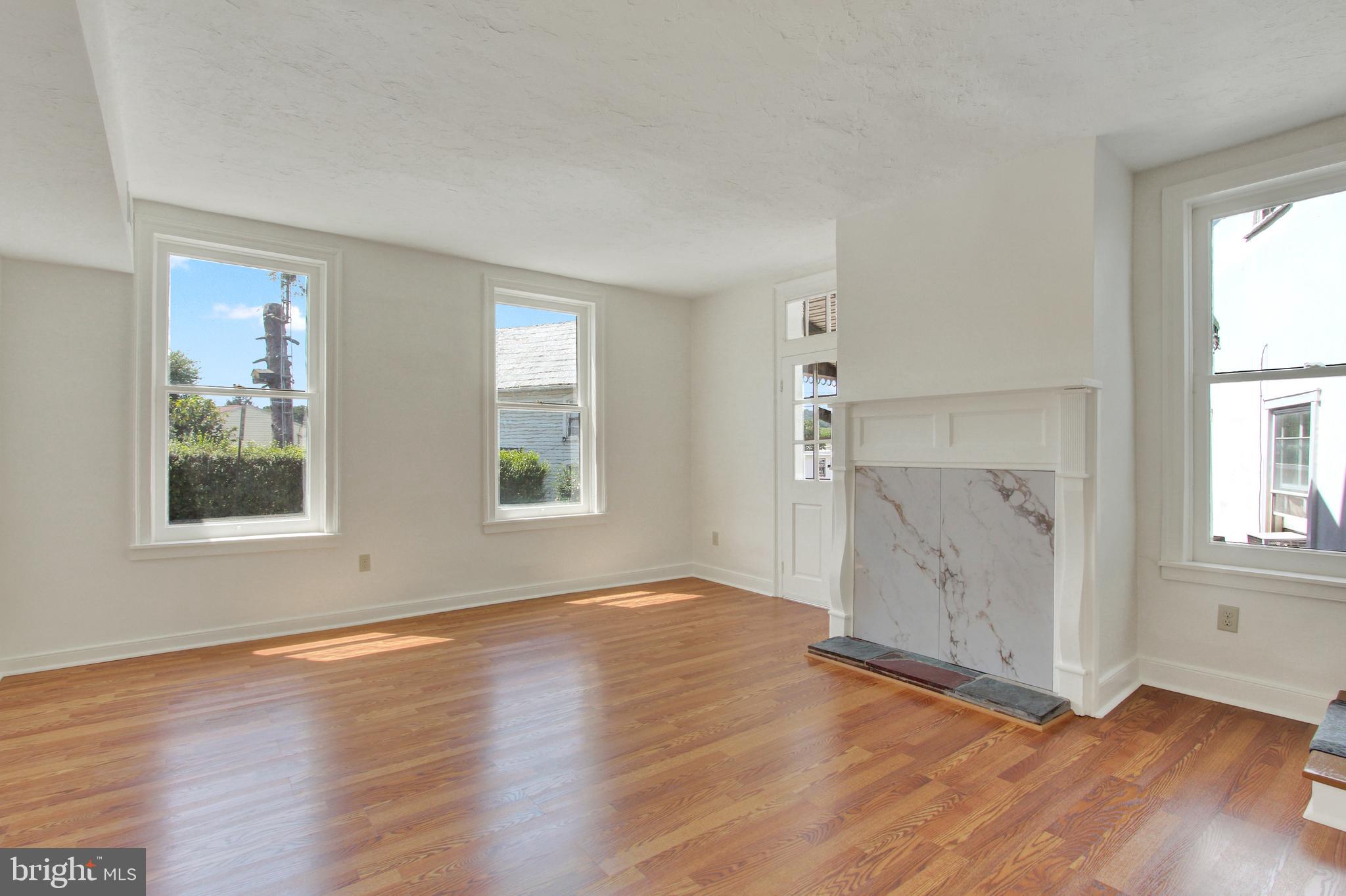 103 Rampike Hill Road Bendersville, PA 17304 - Photo 14 of 22 an empty room with wooden floor and windows