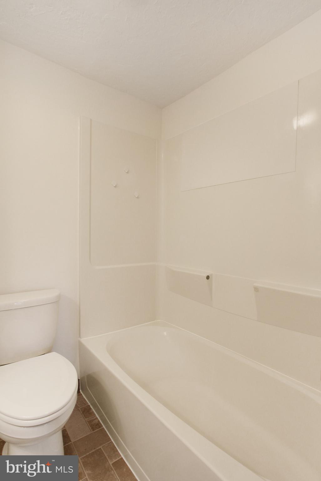 103 Rampike Hill Road Bendersville, PA 17304 - Photo 22 of 22 a white bath tub sitting next to a white toilet