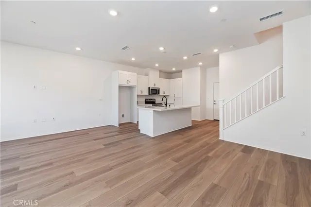 a view of kitchen with cabinets and wooden floor