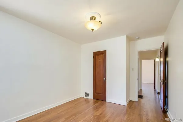 a view of a livingroom with wooden floor