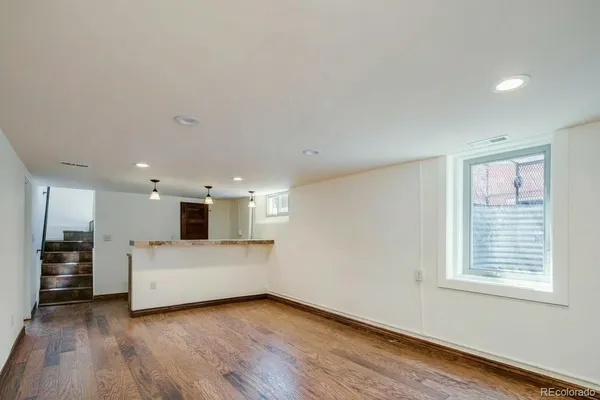 a view of a kitchen with a sink and a stove top oven