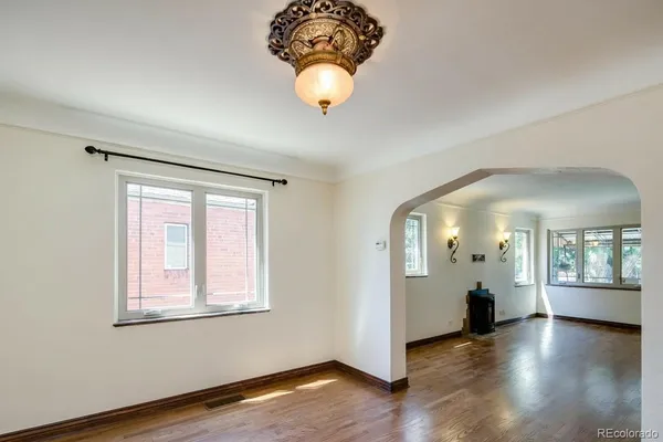 a view of an entryway with wooden floor