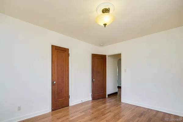 a view of a livingroom with wooden floor