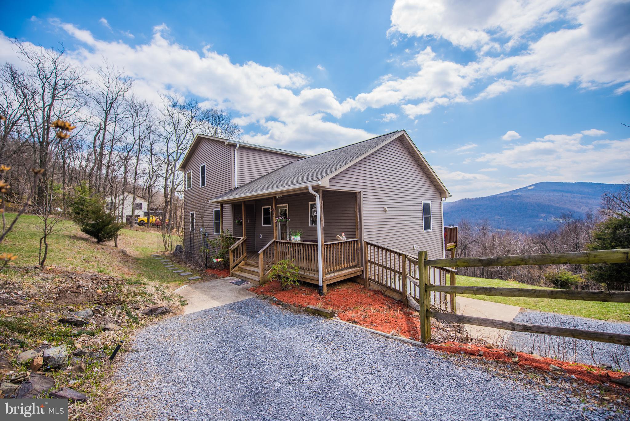964 Granny Smith Road Linden, VA 22642 - Photo 2 of 30 a view of a house with a yard and wooden fence