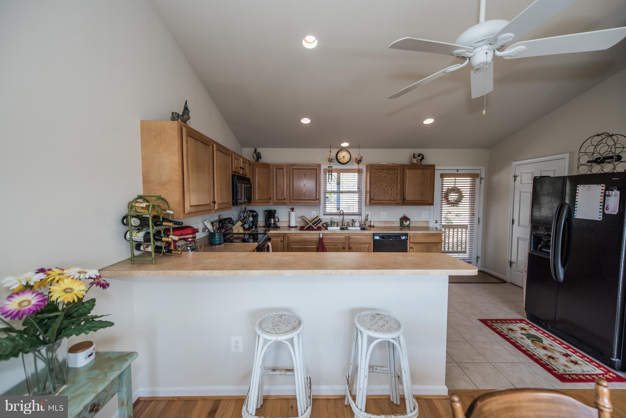 964 Granny Smith Road Linden, VA 22642 - Photo 14 of 30 a view of a dining room with furniture and a kitchen