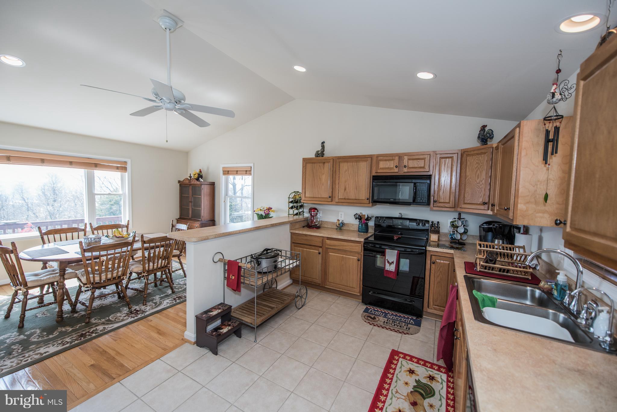 964 Granny Smith Road Linden, VA 22642 - Photo 16 of 30 a living room with stainless steel appliances furniture and a kitchen view