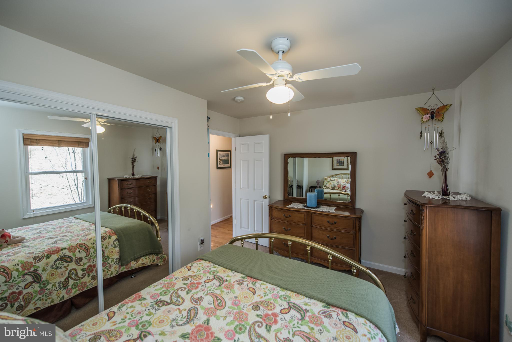 964 Granny Smith Road Linden, VA 22642 - Photo 19 of 30 a bedroom with a bed and wooden floor