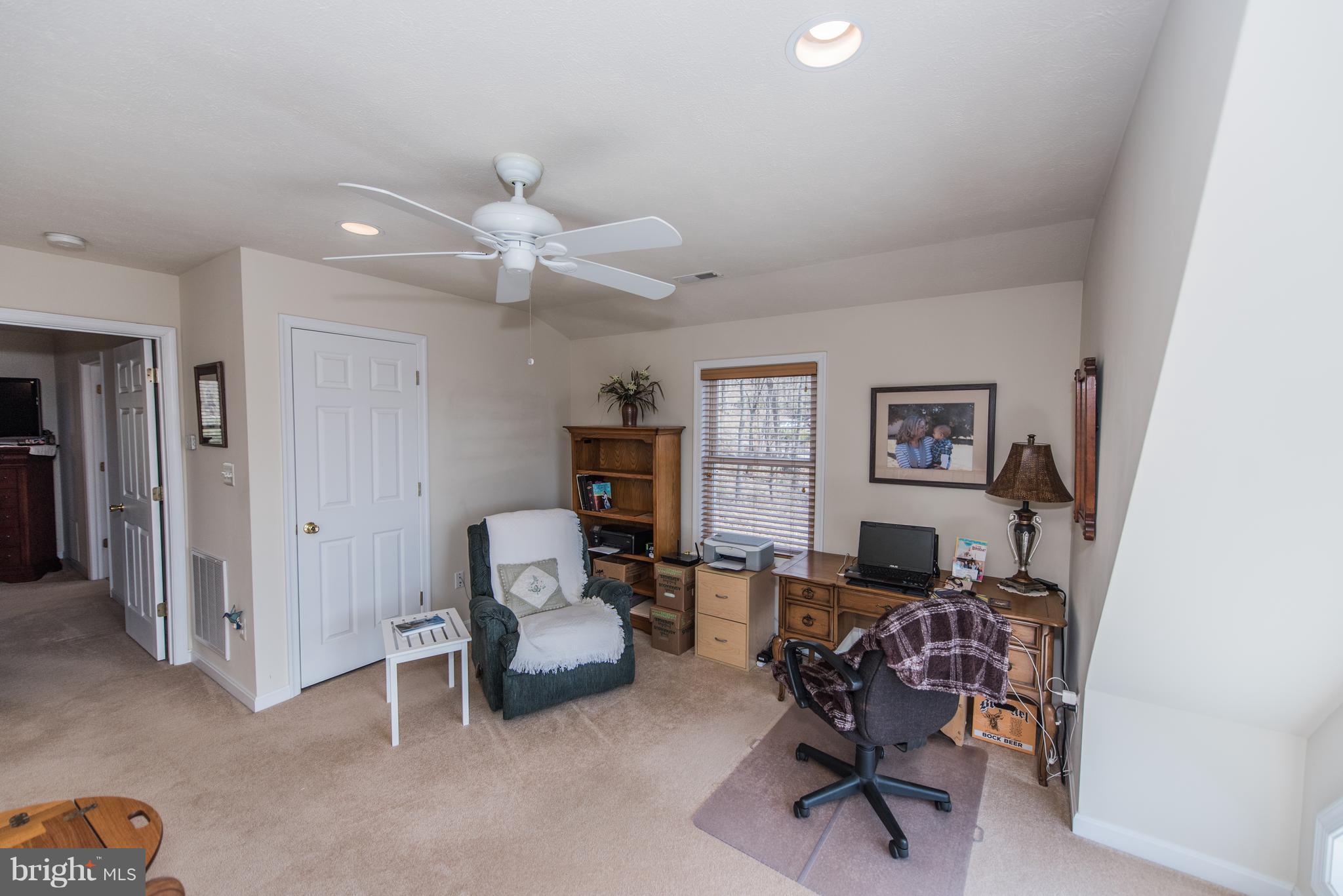 964 Granny Smith Road Linden, VA 22642 - Photo 24 of 30 a living room with furniture and a ceiling fan