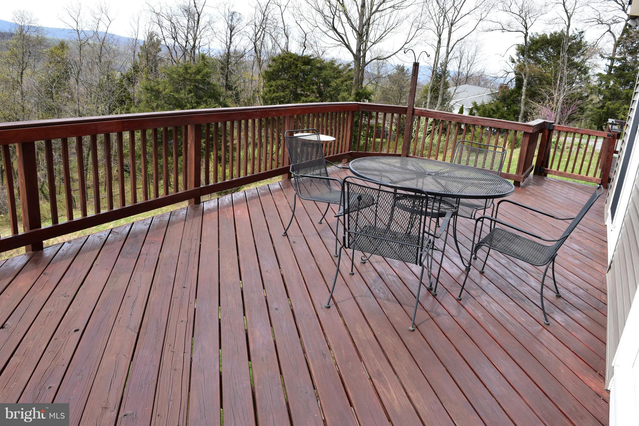 964 Granny Smith Road Linden, VA 22642 - Photo 5 of 30 a view of balcony with furniture and wooden floor