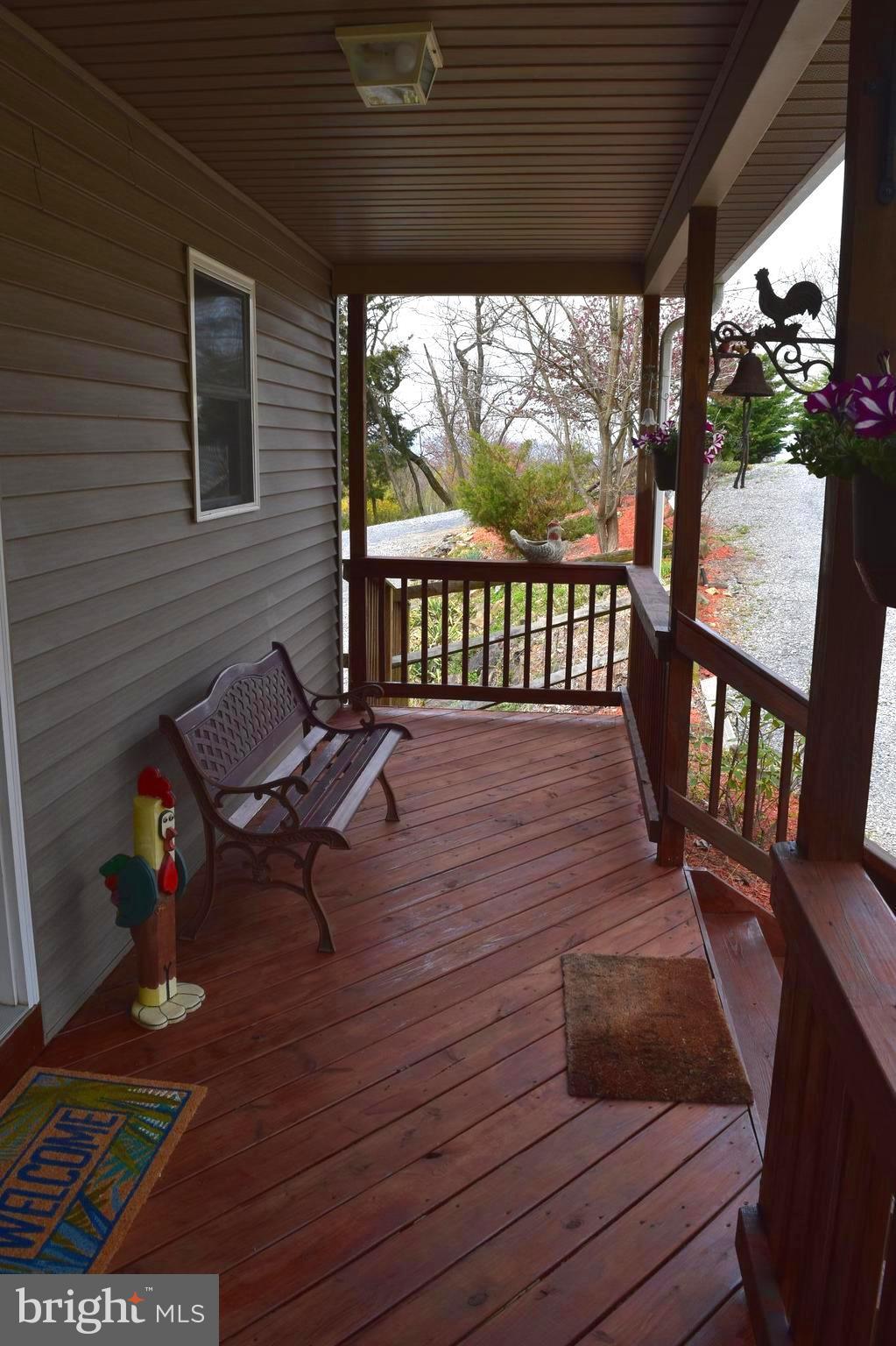 964 Granny Smith Road Linden, VA 22642 - Photo 7 of 30 a view of a wooden chairs on the deck