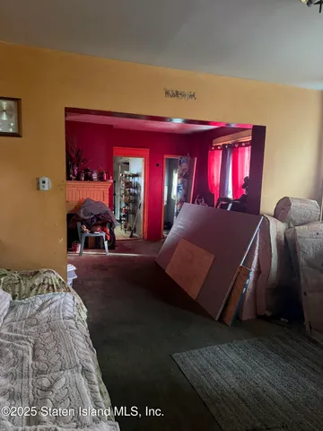 a bedroom with bed and window