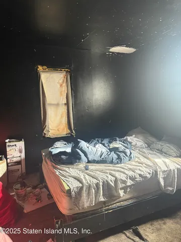 a bedroom with two beds and a mirror